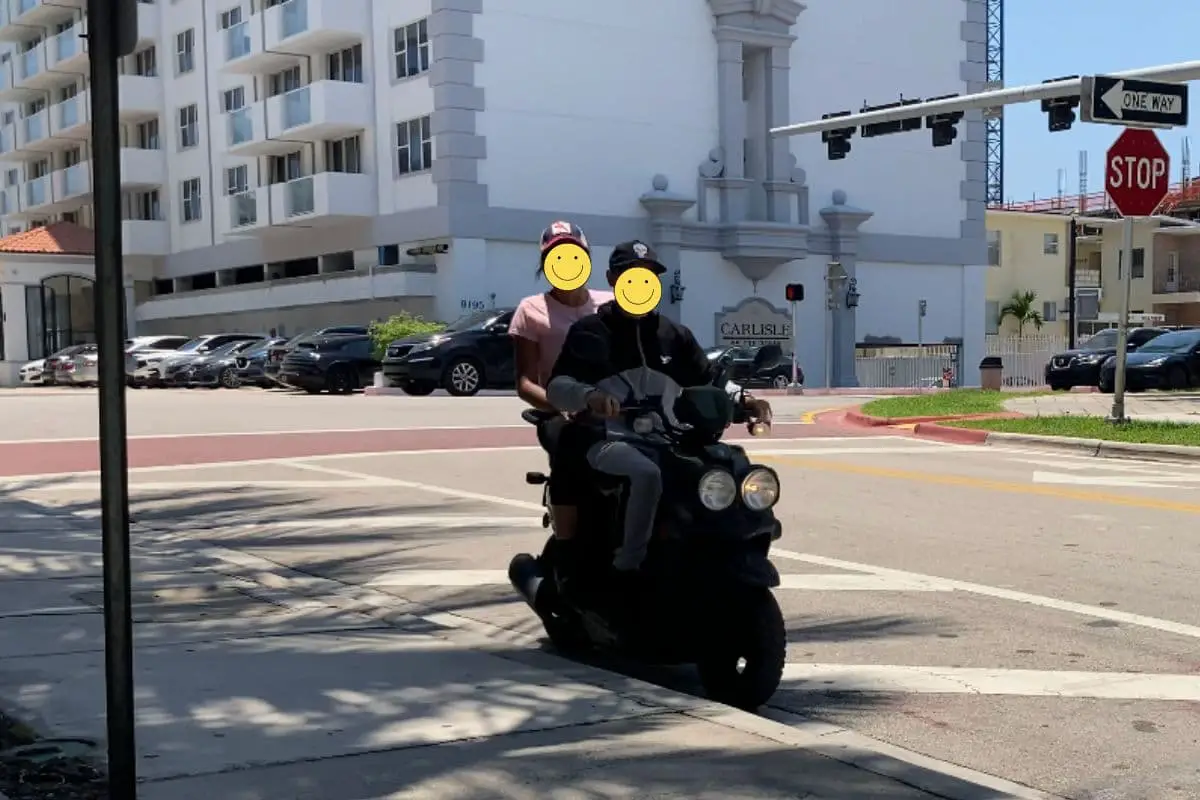 2 people on a scooter for DoorDash