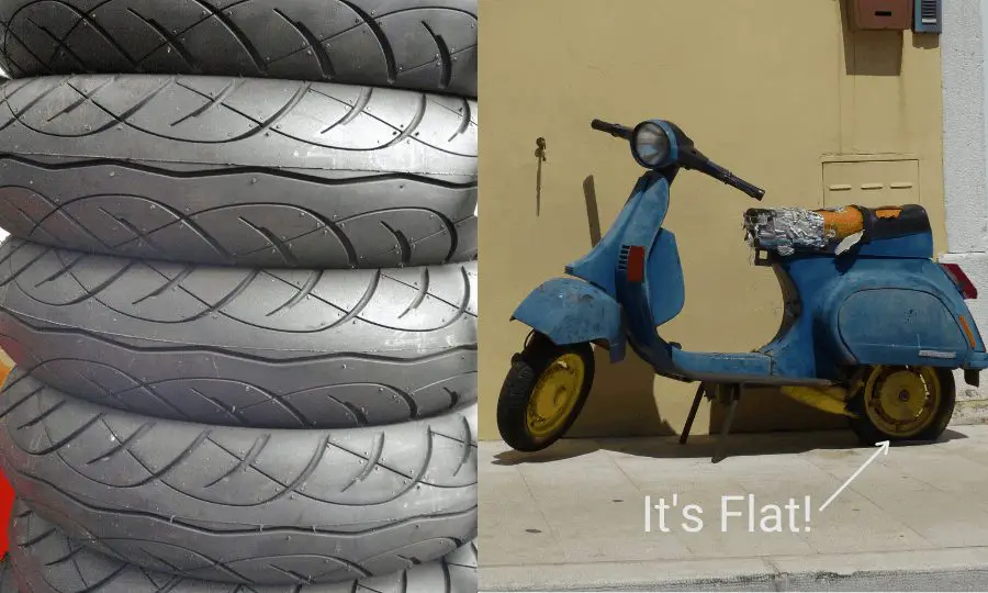 Image of scooter with a flat tire and a stack of scooter tires