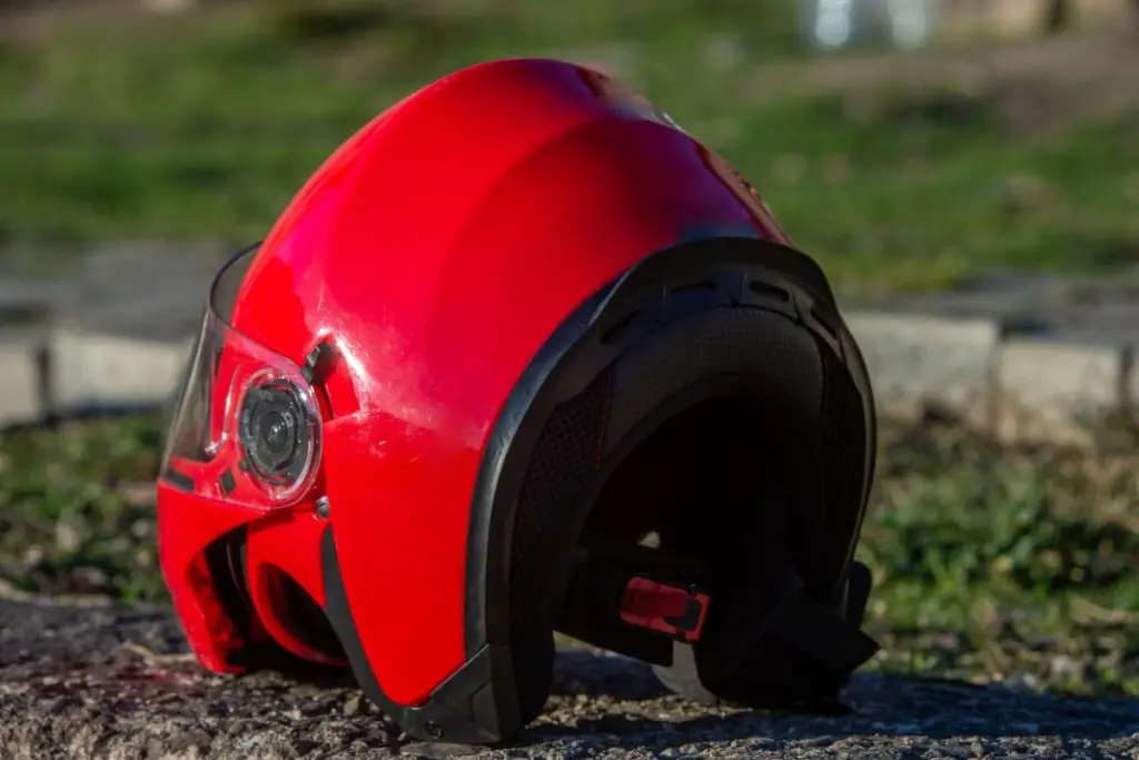 red helmet that appears to have fallen & likely caused damage.