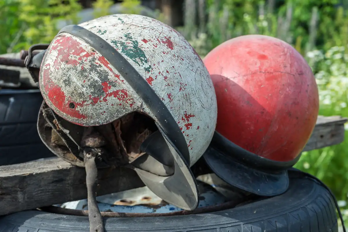 helmets with visible cracks and scuffs
