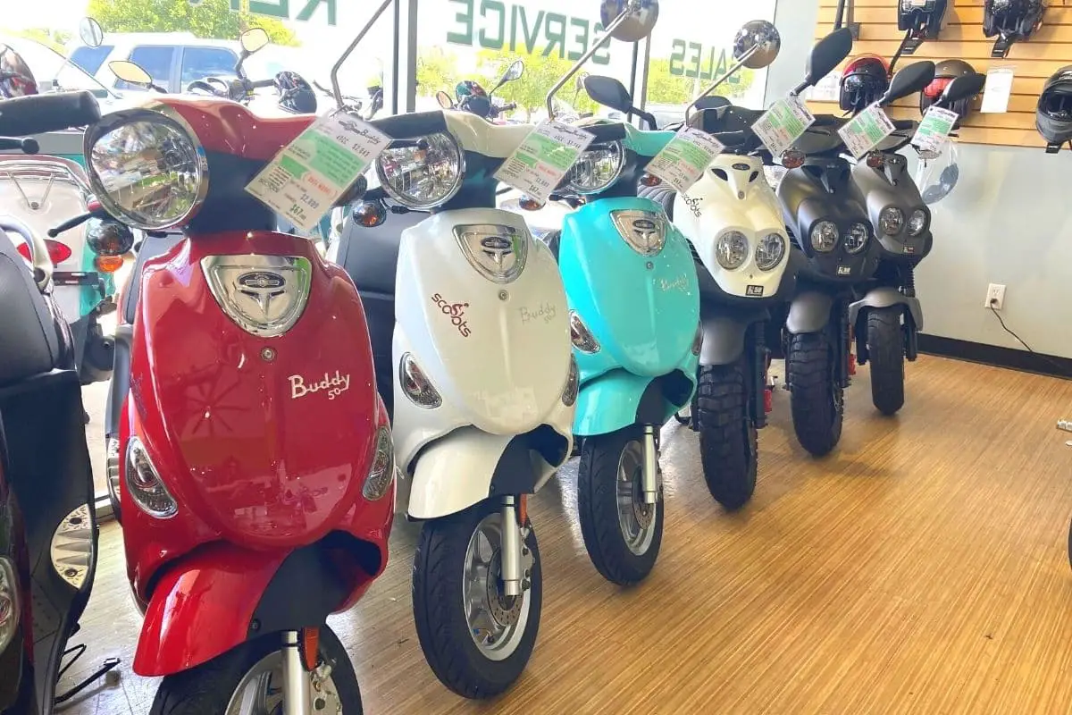 Genuine brand scooters in a row at a dealership
