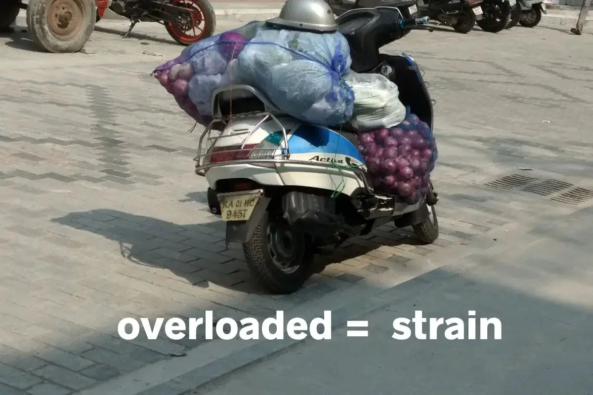 scooter loaded down with multiple bags of onions
