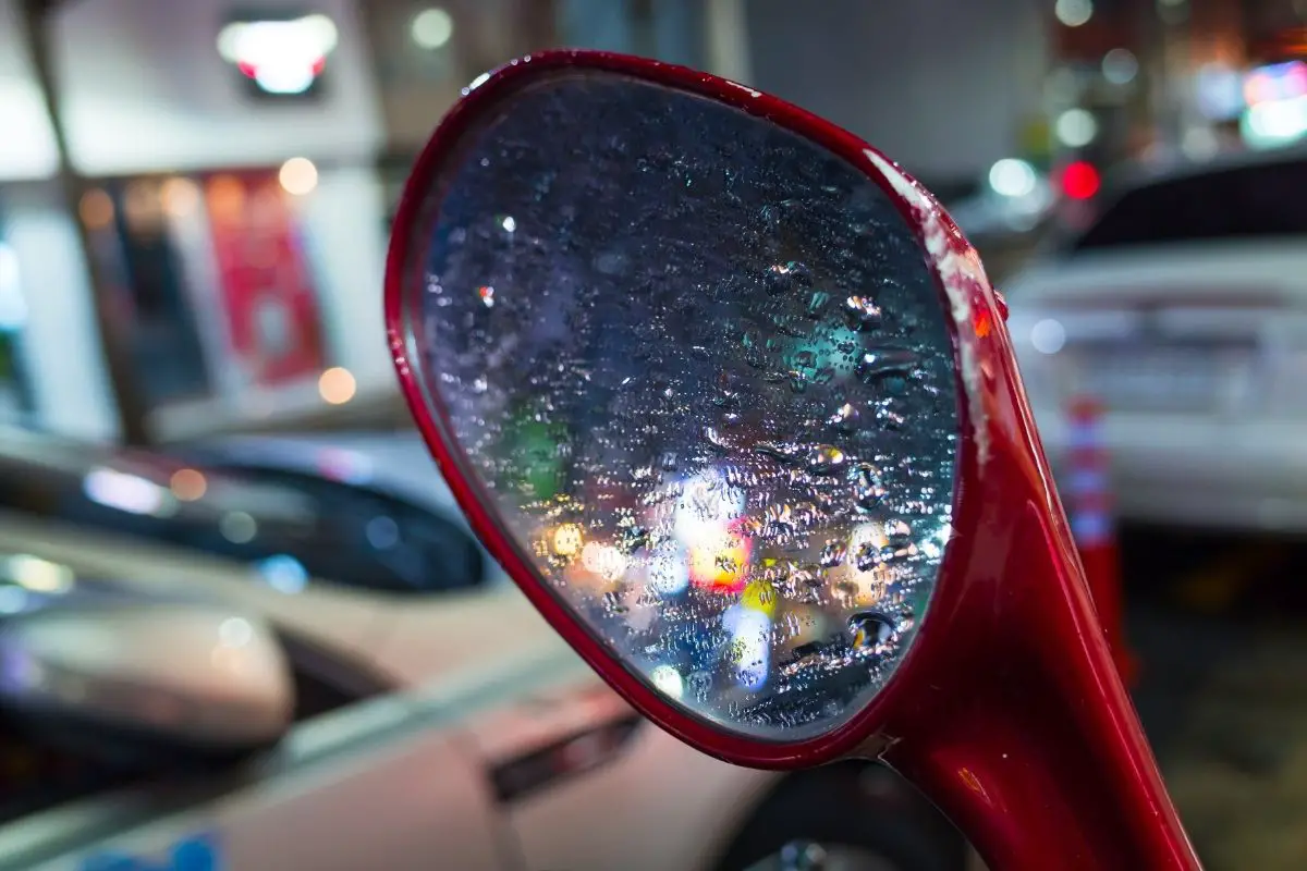 scooter mirror with rain collected on it reducing what you can see through it