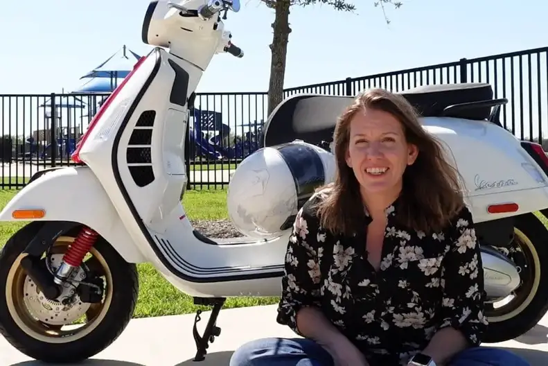Renee in front of Vespa GTS 300