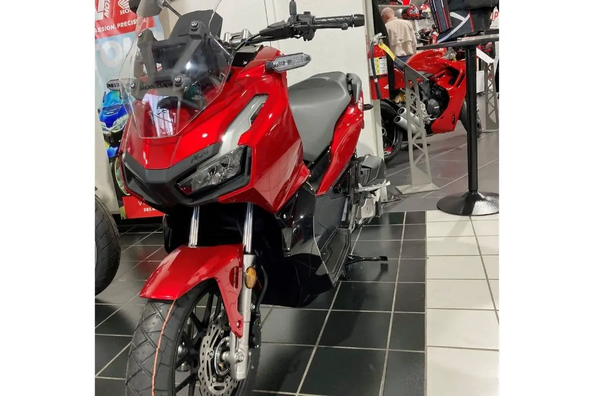 Red Honda ADV at a Honda PowerSports dealer