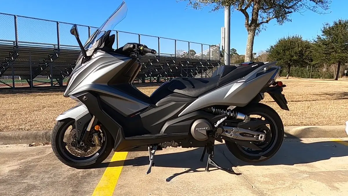 2022 Kymco AK550 side view in matte gray